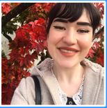 A person smiling for a selfieDescription automatically generated