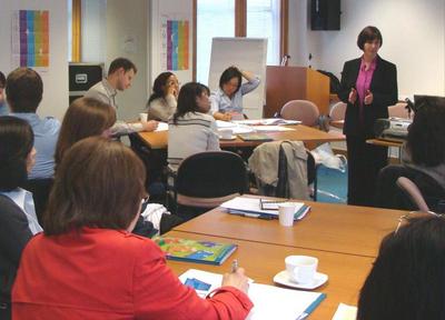 Delegates listening to Hilly Day speak about Asset Languages